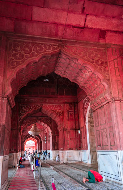 istock people offering Salah at ancient mosque vintage dome view from unique perspective 1391889360