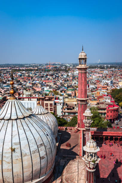 istock ancient mosque vintage dome and tower with crowded city construction at morning from unique angle 1391889600
