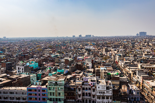 crowded city construction with flat hazy sky at morning from unique angle image is taken at delhi india on Mar 30 2022.