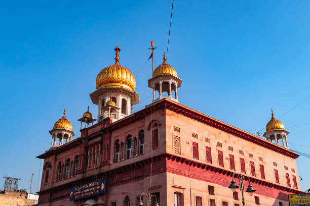 istock sikh holy religious gurudwara with dome with bright blue sky 1391891389