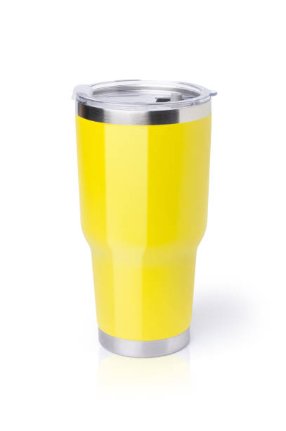 Modern yellow stainless steel drinking glass (thermos tumbler mug) isolated on white backgtound.