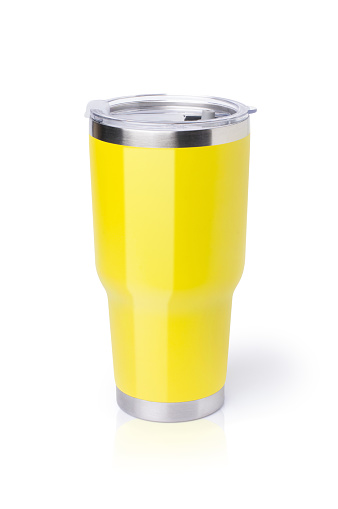 Modern yellow stainless steel drinking glass (thermos tumbler mug) isolated on white backgtound. Clipping path.