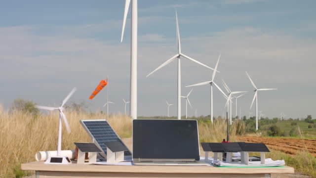 Model Wind Turbine and solar farm on table  in Wind turbine field