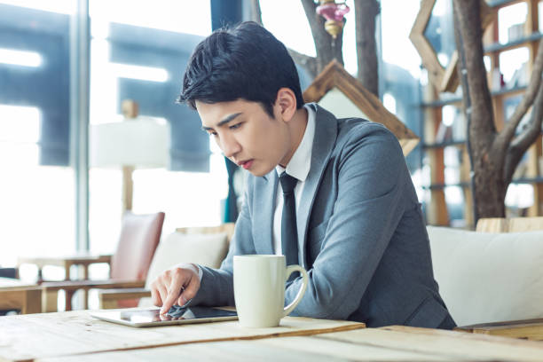 istock in the cafe chinese businessman 1391900097