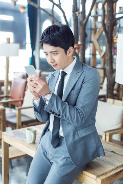 istock in the cafe chinese businessman 1391900264