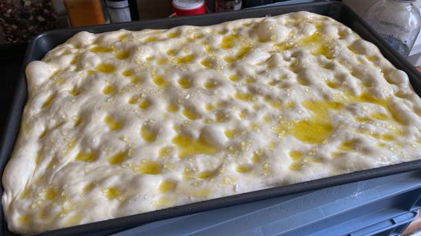 istock Focaccia bread, white pizza bread, salt and rosemary 1391900453
