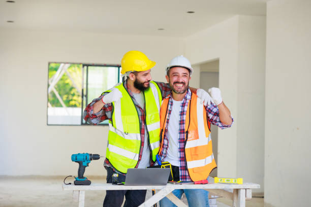istock handshake. Electrician and construction engineer man team in safety uniform working and  planing in construction site. 1391903168