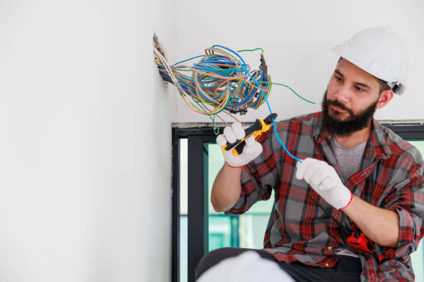 istock Hispanic male Electrician engineer installer with a tool in his hands. Maintenance service Repair and handyman concept 1391903248