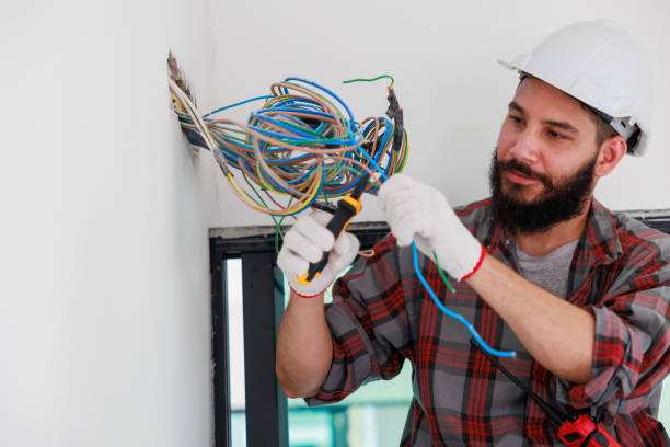 istock Hispanic male Electrician engineer installer with a tool in his hands. Maintenance service Repair and handyman concept 1391903254