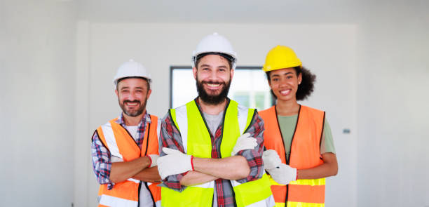 istock Professional Mechanical Engineer team wearing safety hard hat helmet working in  manufacturing factory under construction site. 1391903337
