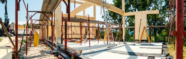 istock Building wooden house in progress, beam frame and steel modular scaffolding 1391908540