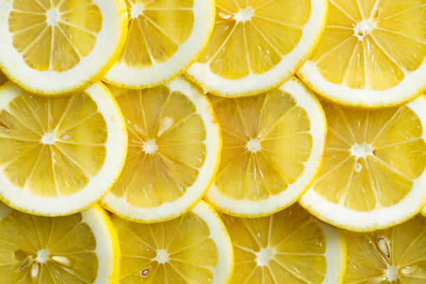 istock A slices of fresh yellow lemon texture background pattern. 1391909845