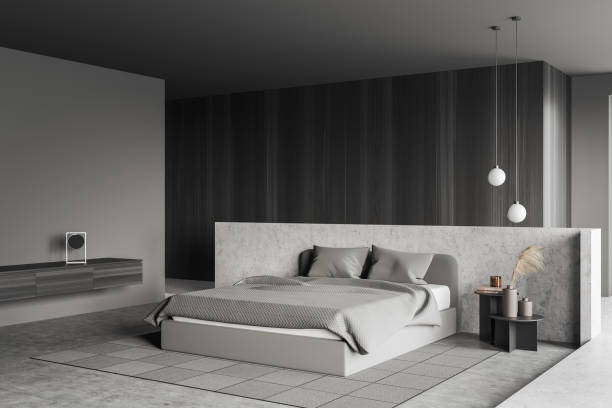 istock Grey bedroom interior with bed on carpet, commode with decoration 1391910911