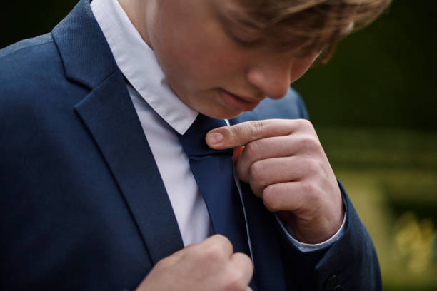 Teenager dressed for his communion