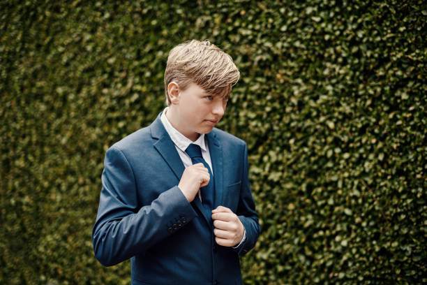 Lutheran Protestant communion. Portrait of teenager in his confirmation suit. fourteen year old boy