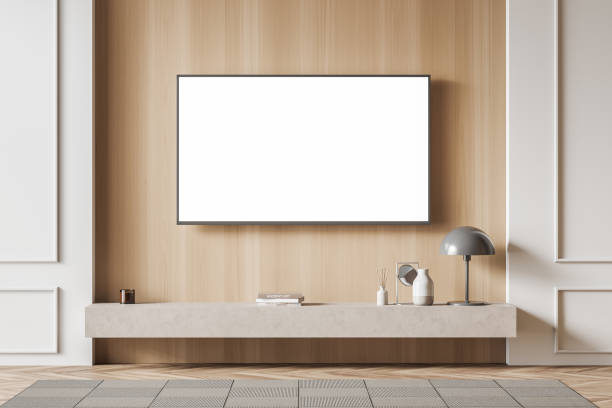 istock Bright living room interior with empty white poster, shelf with books 1391912209