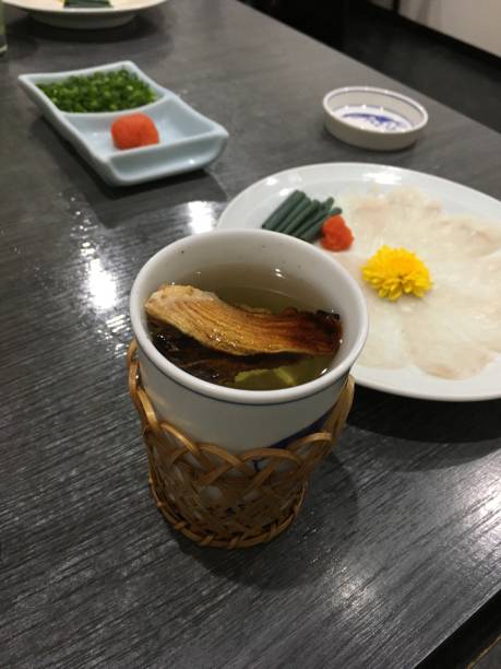 Puffer fish fin in Sake stock photo