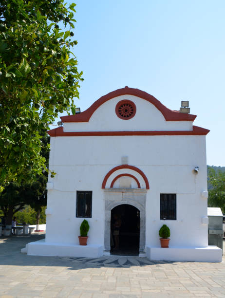 istock white greek church with orange tree in front of it 1391916959
