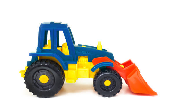 istock colorful plastic toy wheeled tractor loader excavator, isolated 1391918057