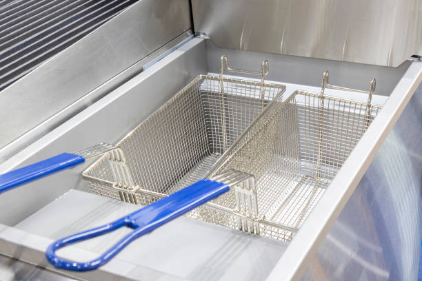 istock New empty modern professional deep fryer basket for  kitchen restaurant 1391918696