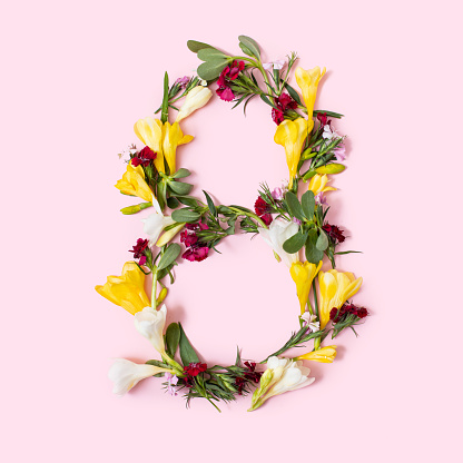 Number 8 made of natural flowers, petals and leaves. Floral font concept. Collection of letters and numbers. Spring, summer and holidays creative idea.