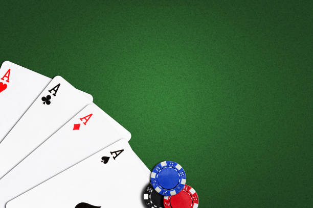 istock Four Aces on a green poker background.Copy Space. Gamble. Playing cards. 1391922215