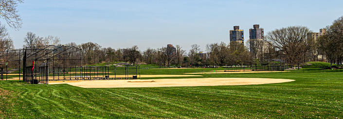 New York, NY, USA: April 14, 2022 - Ball fields in Manhattan's Central Park stand empty awaiting play on a weekday in mid-April. Ball field maintenance appears to be almost complete in anticipation of spring weekend baseball permitted games.