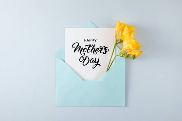 istock Yellow Flowers with White Greeting Card in Blue Envelope 1391928121
