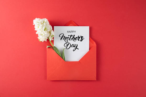 istock White Flowers with White Greeting Card in Red Envelope 1391928376