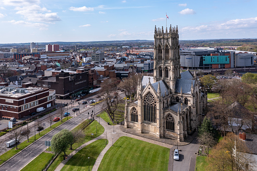 Doncaster, UK - April 15, 2022.  An aerial landscape view of The Minster Church of St George in a  Doncaster town centre cityscape with the Frenchgate centre shopping mall