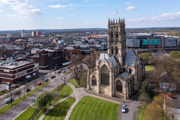 Aerial view of The Minster Church of St George in Doncaster town centre Doncaster, UK - April 15, 2022.  An aerial landscape view of The Minster Church of St George in a  Doncaster town centre cityscape with the Frenchgate centre shopping mall doncaster photos stock pictures, royalty-free photos & images