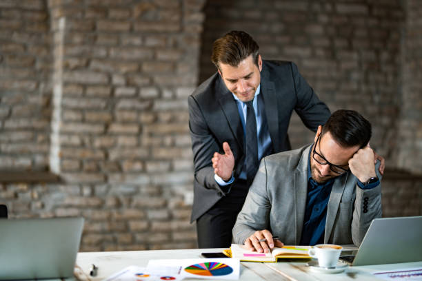 istock Two businessman failing at work. 1391933278