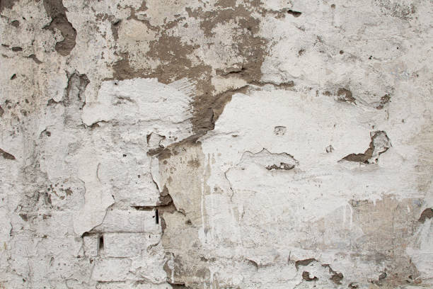 istock Texture of plaster with peeling paint, close-up, copy space. 1391934942