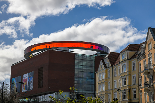 Zurich, Switzerland - May 22, 2018: View of the Zurich Hallenstadion, as well as the Zurich exhibition center behind it. In front of the indoor stadium is the ZSC Lions square with the well-known yellow fountain.