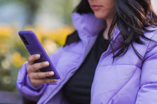 Photo of Close-up of a woman using smart phone