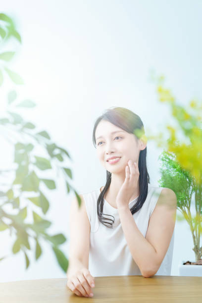 istock A smiling woman surrounded by greenery 1391938431