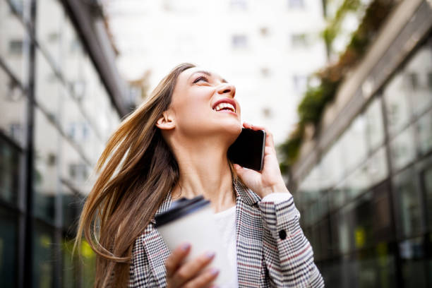 istock Self-confident young businesswoman using phone 1391939644