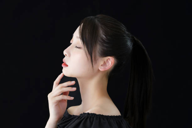istock A young woman with a hand on her face 1391939649