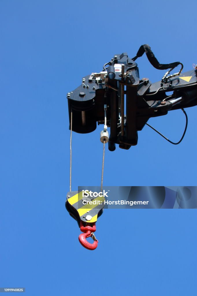 Hook on a construction crane, for picking up heavy weights with a chain Above Stock Photo