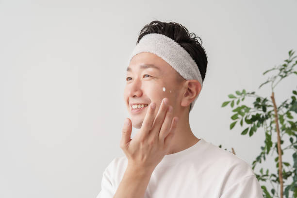 istock Middle man applying cream to his face 1391941550