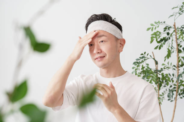 istock Middle man applying cream to his face 1391941568