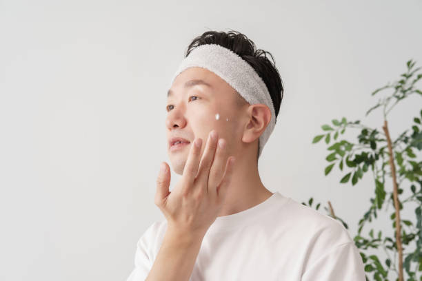 istock Middle man applying cream to his face 1391941611