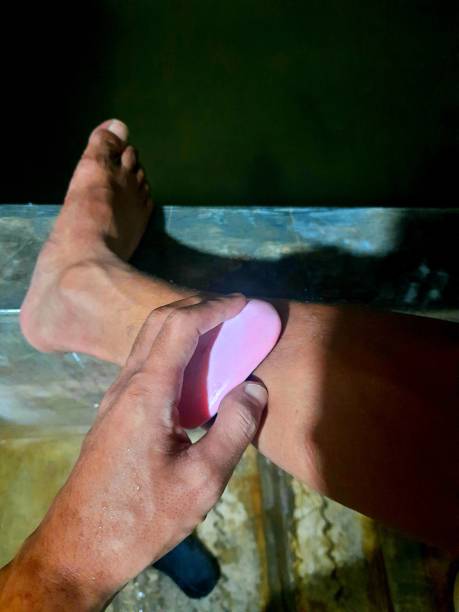 istock someone who is cleaning his feet using soap in the bathroom 1391941925