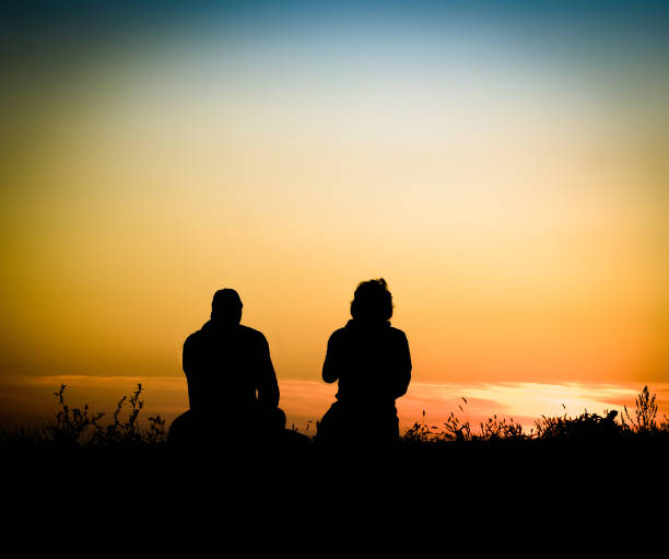 istock couple in field at sunset 1391942752