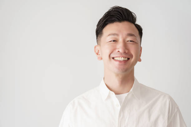 istock Smile middle man in white shirt 1391942767