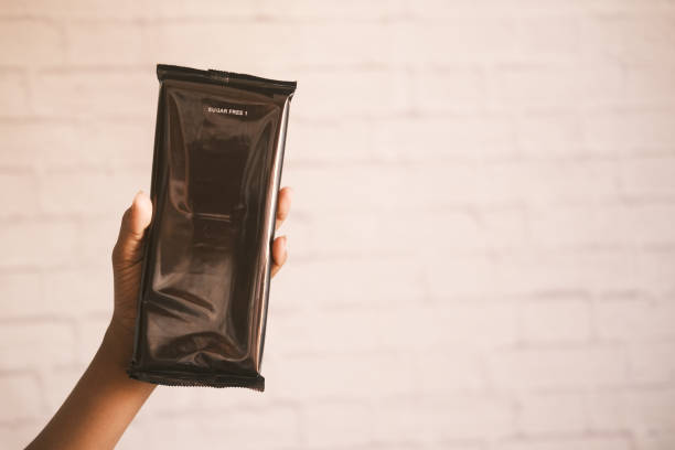 istock holding sugar free dark chocolate packet 1391948457