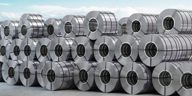 Rolls of metal sheet. Zinc, aluminium or steel sheet rolls on warehouse in factory. stock photo