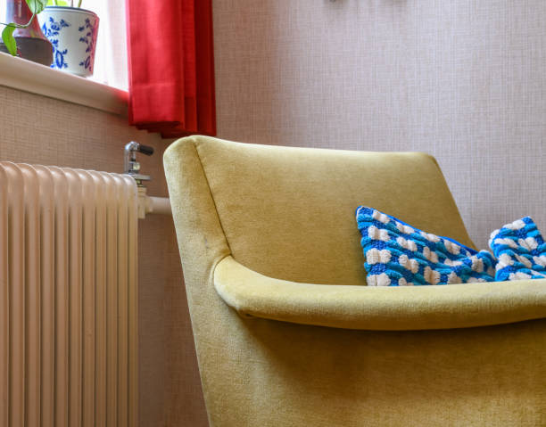 istock Chair by a radiator at home 1391951585