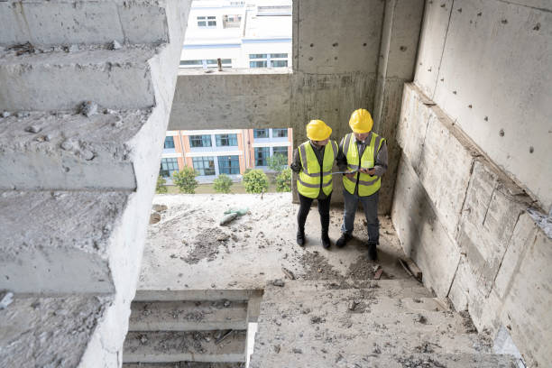 istock Two engineers were inspecting the quality of work at an office building construction site. 1391953771