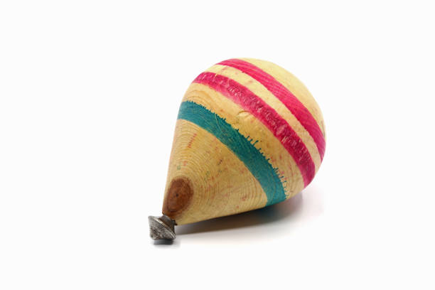 istock a colorful spinning top isolated on a white background 1391953879